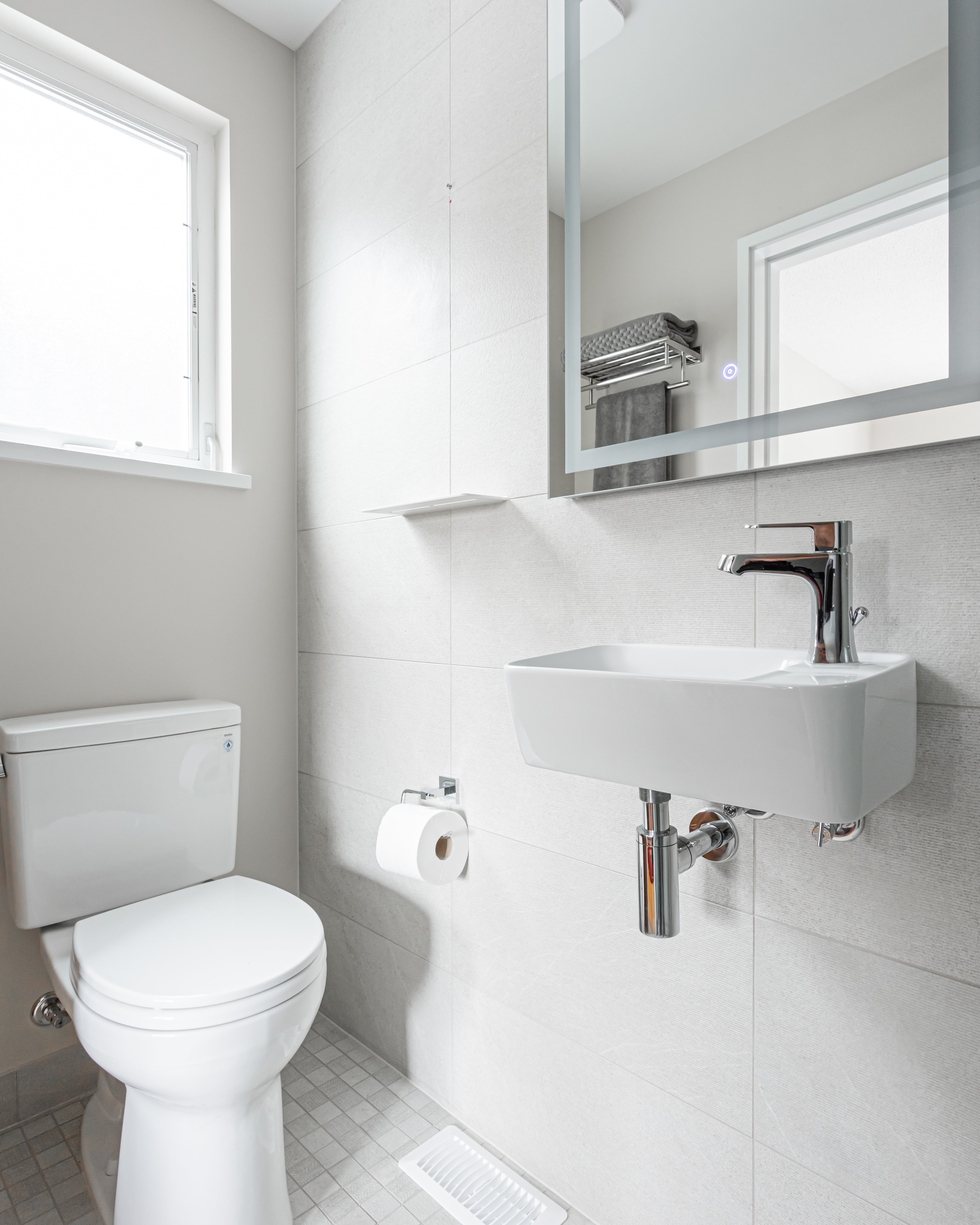 Vancouver white bathroom with floating sink