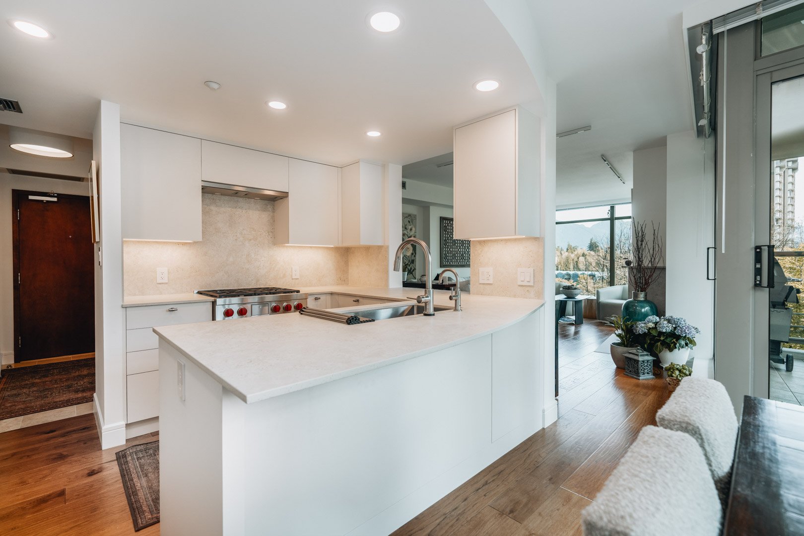 55-00-Wide angle of a bright open-concept kitchen and living area with contemporary finishes, Vancouver.