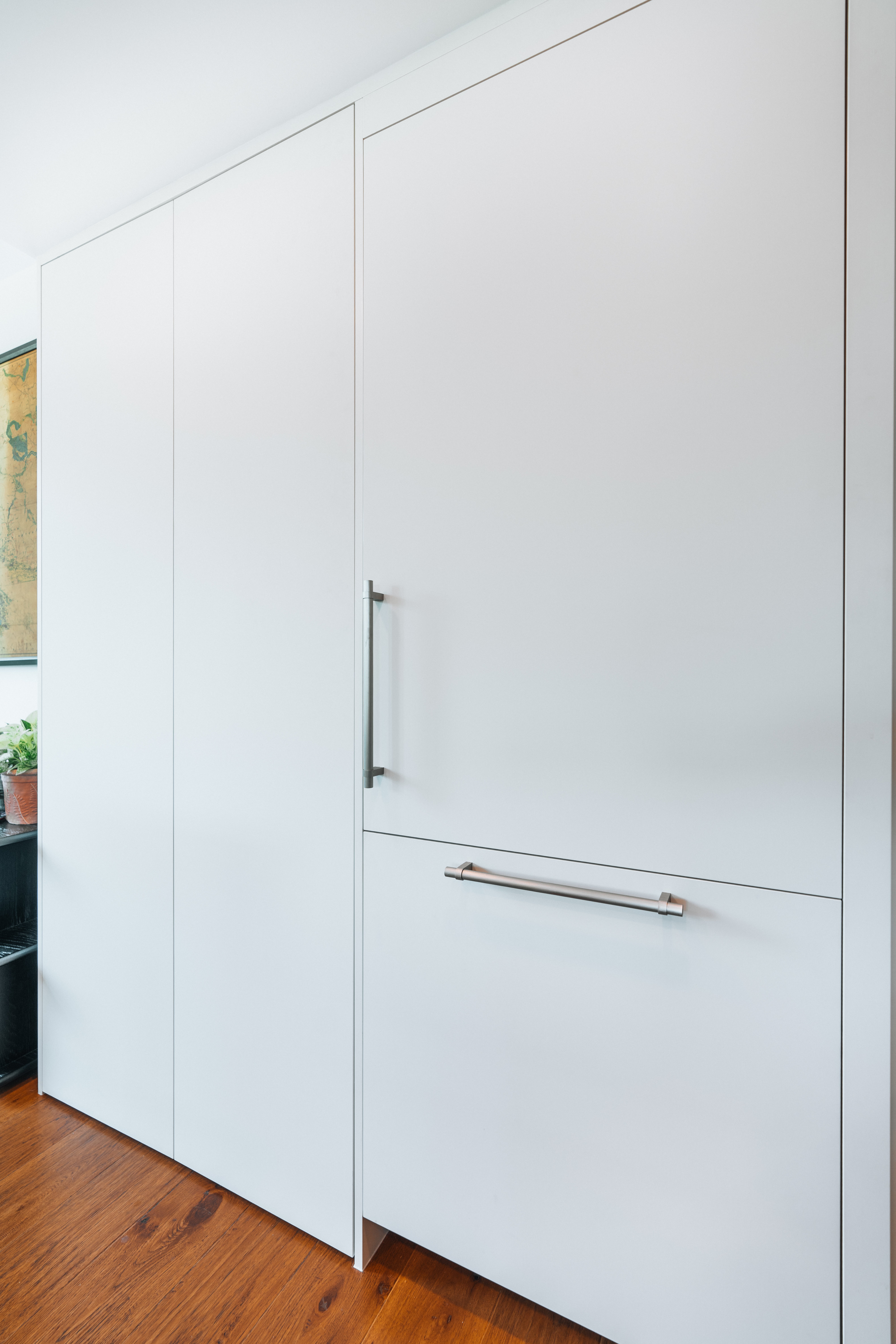 55-00-Seamless integrated white kitchen panel cabinetry with streamlined steel handles, Vancouver.