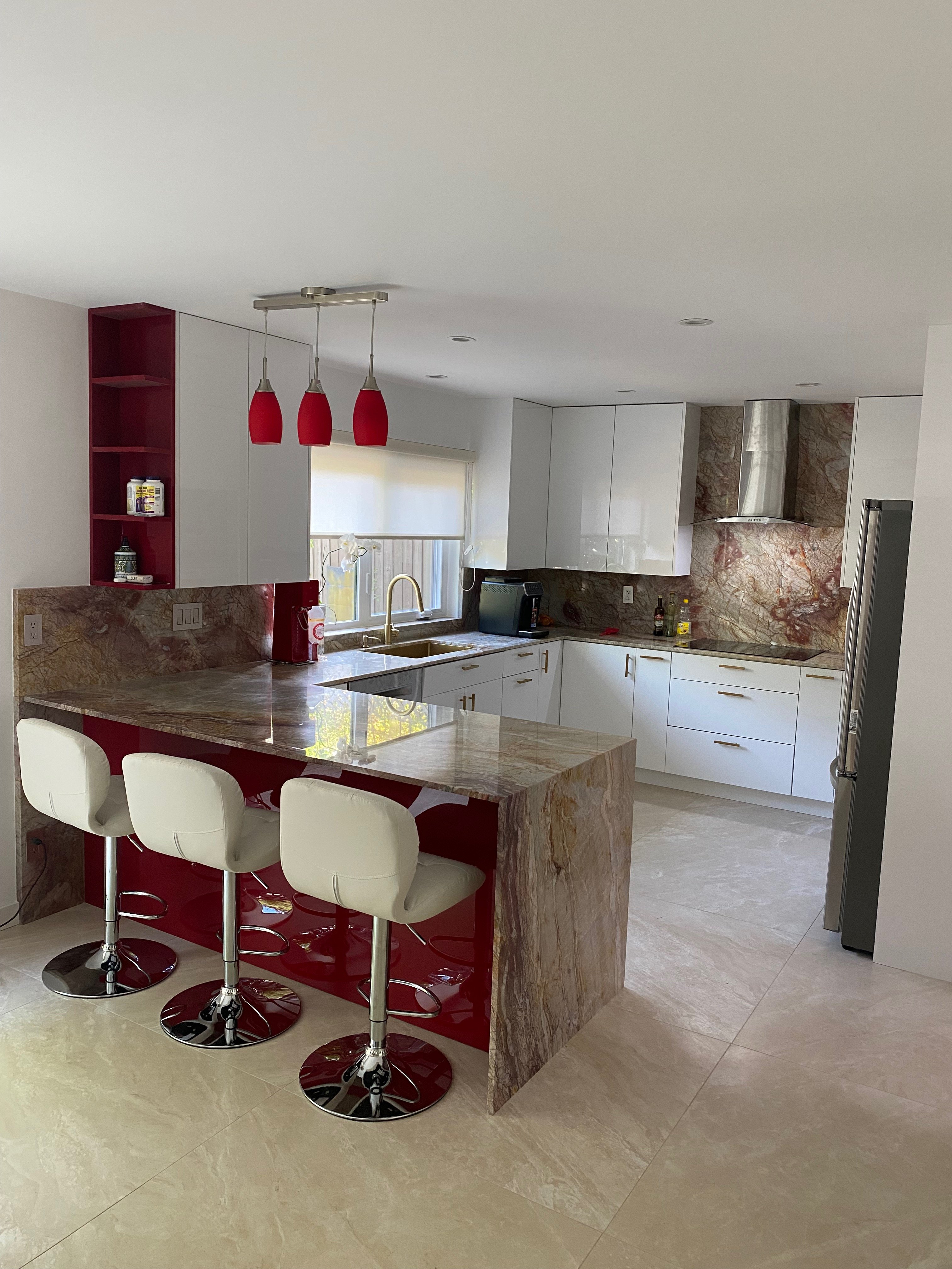 Modern Kitchen with White Cabinets and peninsula island with barstools