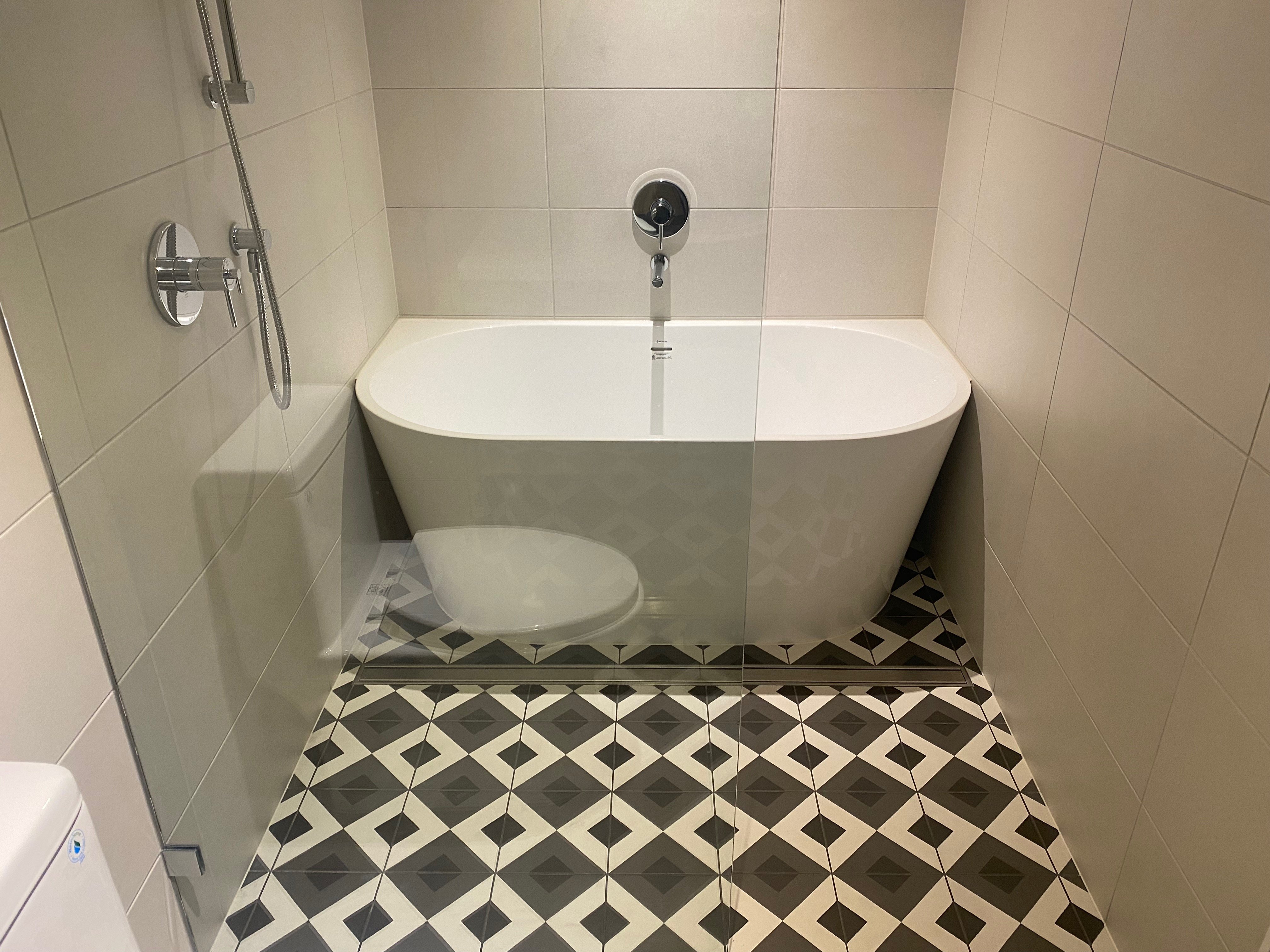 Vancouver bathroom with statement tile and deep tub