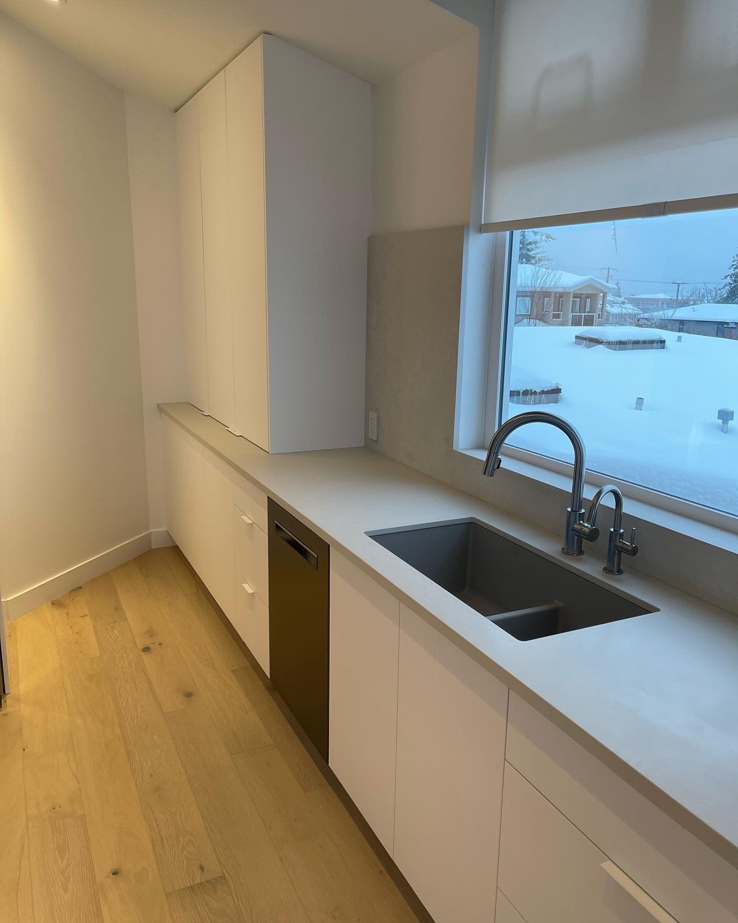 Springer Ave-Contemporary Vancouver kitchen counter with undermount sink, white cabinets, and dishwasher
